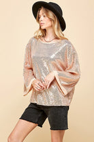 Celebrate any special occasion in this festive top! Featuring a solid sequin design, round neck and bell sleeves, as well as full lining, it’s the perfect addition to your party wardrobe. Perfect for celebrating the holidays! Avah Couture