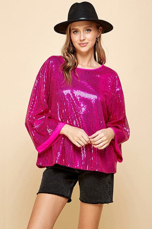 Celebrate any special occasion in this festive top! Featuring a solid sequin design, round neck and bell sleeves, as well as full lining, it’s the perfect addition to your party wardrobe. Perfect for celebrating the holidays! Avah Couture