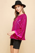 Celebrate any special occasion in this festive top! Featuring a solid sequin design, round neck and bell sleeves, as well as full lining, it’s the perfect addition to your party wardrobe. Perfect for celebrating the holidays! Avah Couture