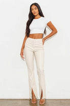 Add a touch of luxury to your wardrobe with these vegan leather pants. Chic, yet comfortable and stylish, they’re versatile enough to be worn anywhere. High waisted with a button fly closure, the front slit detail adds interest to the design while the stretch fabric helps these pants move with you throughout the day.   Avah Couture