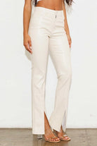 Add a touch of luxury to your wardrobe with these vegan leather pants. Chic, yet comfortable and stylish, they’re versatile enough to be worn anywhere. High waisted with a button fly closure, the front slit detail adds interest to the design while the stretch fabric helps these pants move with you throughout the day.   Avah Couture