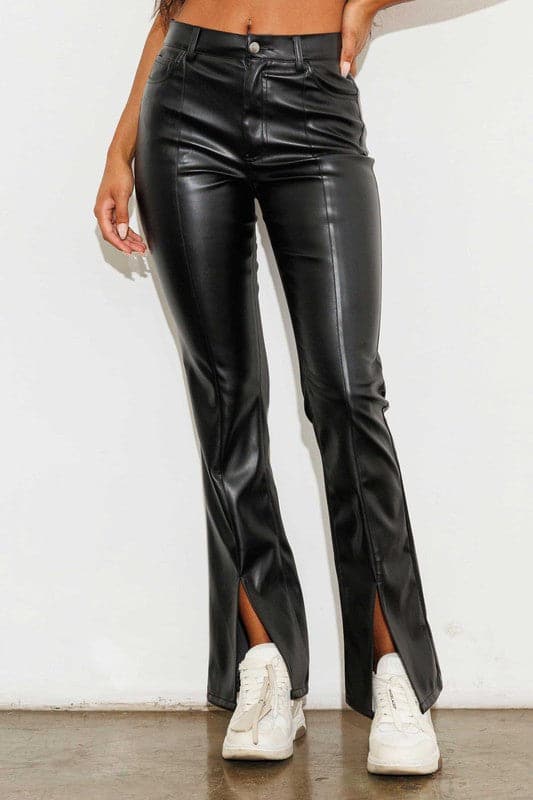 Add a touch of luxury to your wardrobe with these vegan leather pants. Chic, yet comfortable and stylish, they’re versatile enough to be worn anywhere. High waisted with a button fly closure, the front slit detail adds interest to the design while the stretch fabric helps these pants move with you throughout the day.   Avah Couture