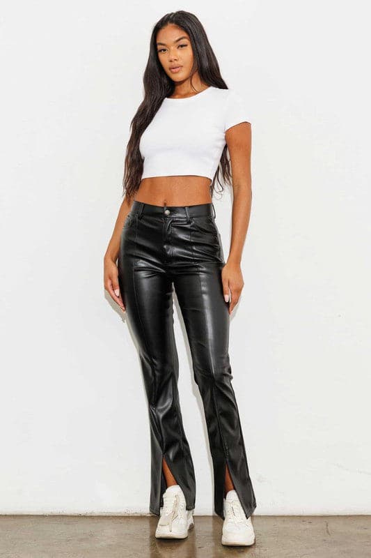 Add a touch of luxury to your wardrobe with these vegan leather pants. Chic, yet comfortable and stylish, they’re versatile enough to be worn anywhere. High waisted with a button fly closure, the front slit detail adds interest to the design while the stretch fabric helps these pants move with you throughout the day.   Avah Couture