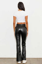 Add a touch of luxury to your wardrobe with these vegan leather pants. Chic, yet comfortable and stylish, they’re versatile enough to be worn anywhere. High waisted with a button fly closure, the front slit detail adds interest to the design while the stretch fabric helps these pants move with you throughout the day.   Avah Couture