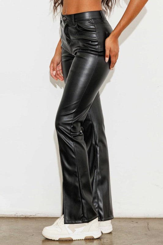 Add a touch of luxury to your wardrobe with these vegan leather pants. Chic, yet comfortable and stylish, they’re versatile enough to be worn anywhere. High waisted with a button fly closure, the front slit detail adds interest to the design while the stretch fabric helps these pants move with you throughout the day.   Avah Couture