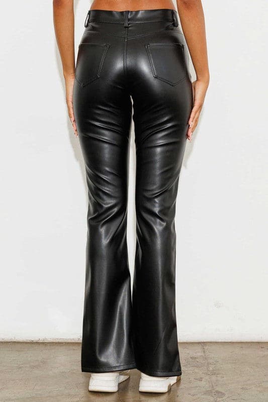 Add a touch of luxury to your wardrobe with these vegan leather pants. Chic, yet comfortable and stylish, they’re versatile enough to be worn anywhere. High waisted with a button fly closure, the front slit detail adds interest to the design while the stretch fabric helps these pants move with you throughout the day.   Avah Couture