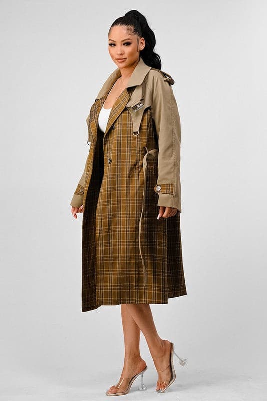 With its plaid and khaki color contrast, this luxurious trench coat is sure to be your new go to for fall and winter. The high quality of the fabric gives it great durability as well as style, making this a favorite among trend setters. With a hook and eye collar closure, back cutout detail, long sleeve, and collared style, this trench coat will look good with anything you wear it with. You can’t go wrong in this unique coat! Avah Couture