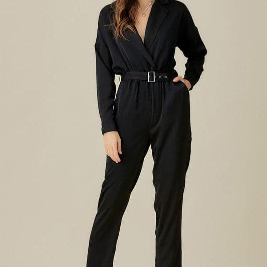 The Daytona Collared Satin Jumpsuit is a must have that never goes out of style. This jumpsuit will be the perfect addition to your wardrobe. It features a belted waist, v neckline, collar and pockets. This satin jumpsuit will keep you looking chic and sophisticated all night long. Avah Couture