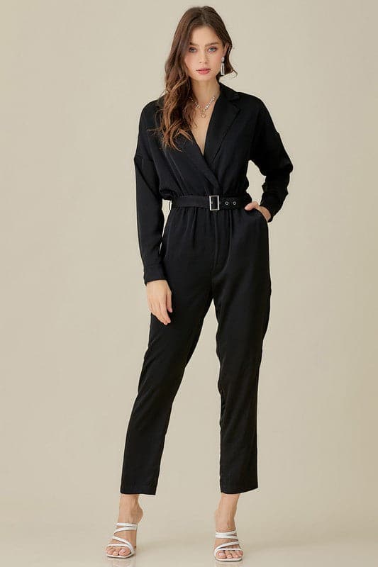The Daytona Collared Satin Jumpsuit is a must have that never goes out of style. This jumpsuit will be the perfect addition to your wardrobe. It features a belted waist, v neckline, collar and pockets. This satin jumpsuit will keep you looking chic and sophisticated all night long. Avah Couture