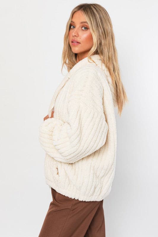 This oversized hoodie jacket is the ultimate in cozy winter style. It features a zipper front and pockets, a relaxed fit and is super soft and comfortable to wear. Zip up and stay warm! Avah Couture