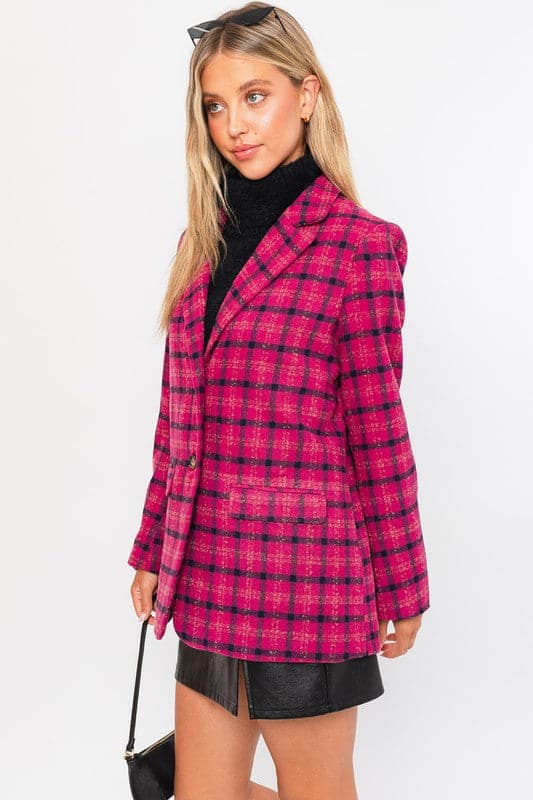 This blazer is the perfect way to add a pop of color and style to your wardrobe. Features a classic silhouette, notched lapel, two button closure and trendy plaid pattern. This stylish jacket can easily be dressed up or down, and will become one of your favorites for years to come. Avah Couture