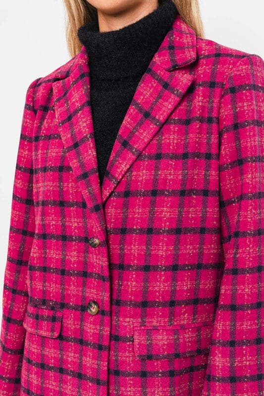 This blazer is the perfect way to add a pop of color and style to your wardrobe. Features a classic silhouette, notched lapel, two button closure and trendy plaid pattern. This stylish jacket can easily be dressed up or down, and will become one of your favorites for years to come. Avah Couture