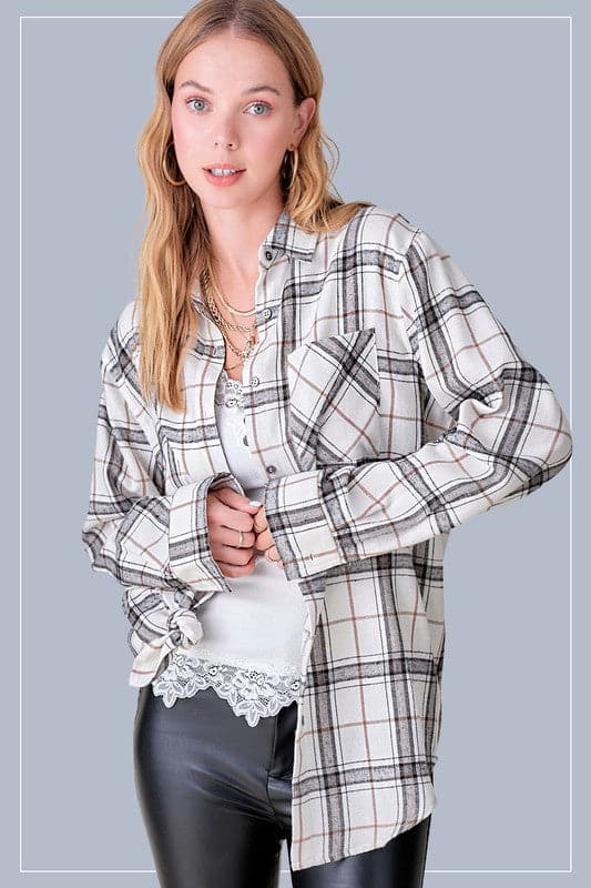 A classic plaid shirt is a staple you’ll wear all year long. Featuring a collar with a button down front, chest pocket, and long sleeves that you can roll up or down. Made with an oversized fit for an easy, effortless vibe.  Avah Couture