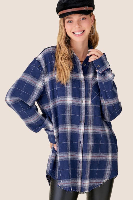 Your new favorite flannel! This oversized checkered plaid shirt is an essential top to add to your closet. Featuring a nice, oversize silhouette and subtle distressing at the sleeves and hemline. This plaid flannel shirt has long sleeves, full button front and will add effortless style to your wardrobe. Great paired with everything from denim to trousers, this comfy flannel shirt is great for loungewear days or weekend wear!  Avah Couture