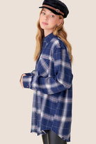 Your new favorite flannel! This oversized checkered plaid shirt is an essential top to add to your closet. Featuring a nice, oversize silhouette and subtle distressing at the sleeves and hemline. This plaid flannel shirt has long sleeves, full button front and will add effortless style to your wardrobe. Great paired with everything from denim to trousers, this comfy flannel shirt is great for loungewear days or weekend wear!  Avah Couture