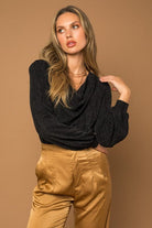 A classic cowl neck, bodysuit is an essential piece of clothing to have in your closet. It’s perfect for the office or a night out, and can be styled both day and night. It comes in long sleeve, so it’s versatile enough to wear year round. Whether you’re headed to work or planning a fun night out, this special occasion bodysuit has got you covered. Avah Couture