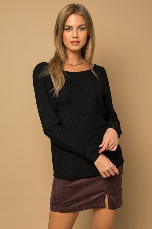 If you’re looking for something sophisticated and unique with a fun twist, this glitter top is the perfect piece. It has a twist back detail, long sleeves and glitter affect for sparkle. Wear this trendy top with jeans or skirts to complete your look!