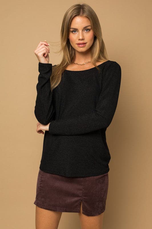 If you’re looking for something sophisticated and unique with a fun twist, this glitter top is the perfect piece. It has a twist back detail, long sleeves and glitter affect for sparkle. Wear this trendy top with jeans or skirts to complete your look!