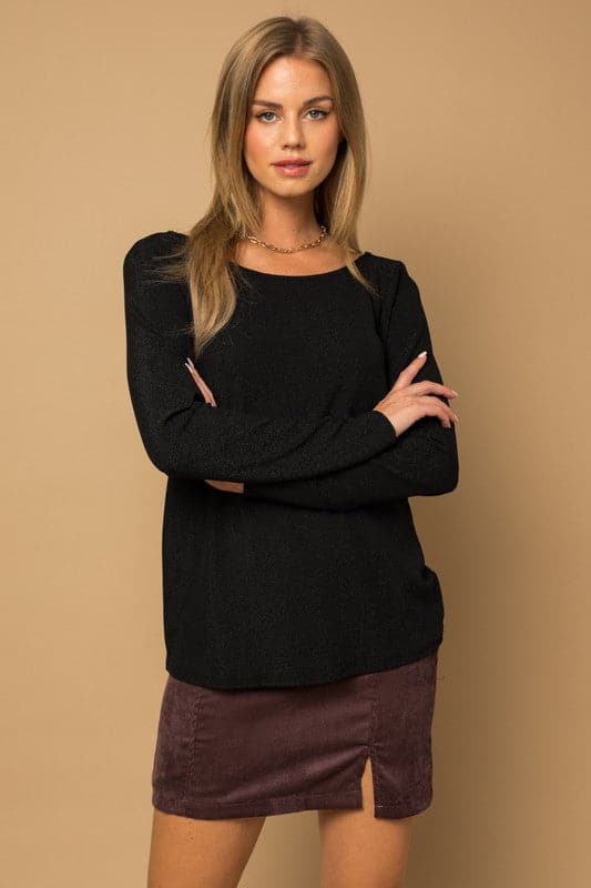 If you’re looking for something sophisticated and unique with a fun twist, this glitter top is the perfect piece. It has a twist back detail, long sleeves and glitter affect for sparkle. Wear this trendy top with jeans or skirts to complete your look!