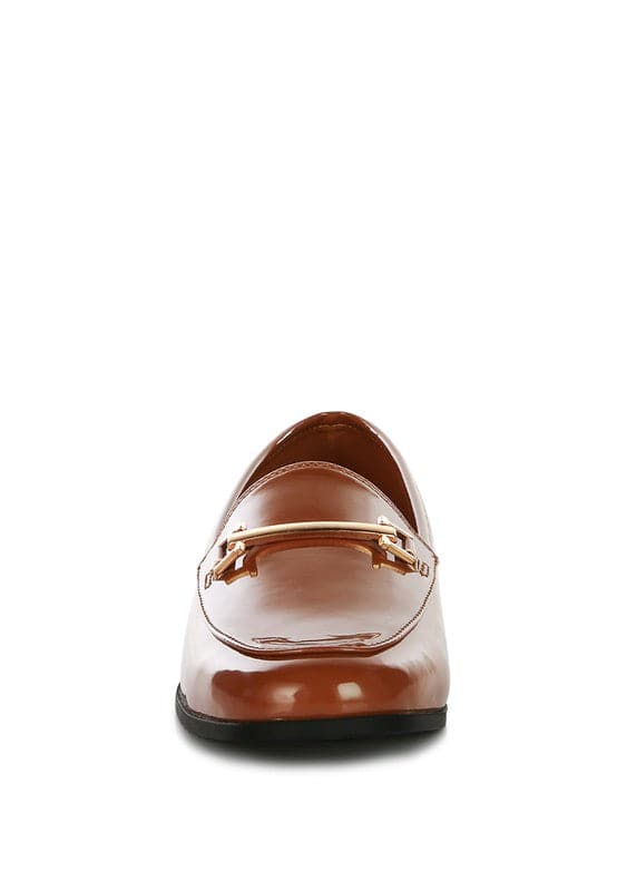 Soft, stylish and chic! These faux leather semi casual loafers are perfect for work and beyond. Featuring shiny golden metal sling detail, these loafers will take you look up a notch. The super soft faux leather upper makes it effortless to slip on and get out the door in style while providing ultimate comfort. Avah Couture