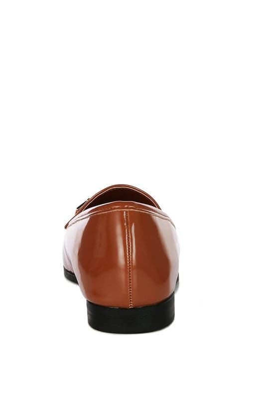 Soft, stylish and chic! These faux leather semi casual loafers are perfect for work and beyond. Featuring shiny golden metal sling detail, these loafers will take you look up a notch. The super soft faux leather upper makes it effortless to slip on and get out the door in style while providing ultimate comfort. Avah Couture