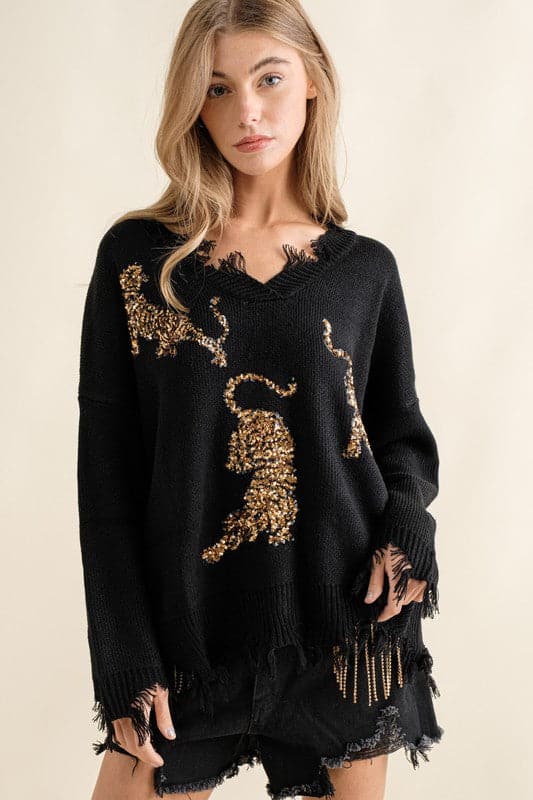 You’ll love this fun, edgy sweater. It’s the perfect way to express your wild side! This v-neck, pullover sweater features sequin tigers and frayed edges, making it the perfect top for weekend outings and casual get-togethers - Avah Couture