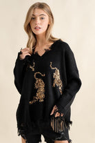 You’ll love this fun, edgy sweater. It’s the perfect way to express your wild side! This v-neck, pullover sweater features sequin tigers and frayed edges, making it the perfect top for weekend outings and casual get-togethers - Avah Couture