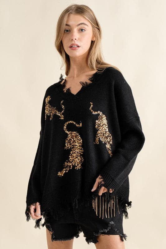 You’ll love this fun, edgy sweater. It’s the perfect way to express your wild side! This v-neck, pullover sweater features sequin tigers and frayed edges, making it the perfect top for weekend outings and casual get-togethers - Avah Couture