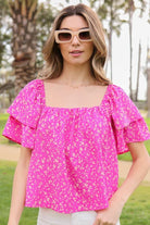 Avah Couture- Make a sweet impression in this smocked square neck blouse covered in delightful blooms. This fuchsia floral top has a self-tie open back and short sleeves accented with ruffles. Embrace the phenomenal florals of spring.  Floral print Smocked square neck Ruffle short sleeves Open back with self-tie Short length- Fuchsia Pink 