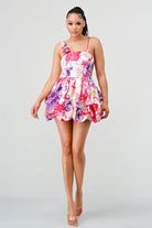 Avah Couture-If you love a sweet, feminine floral dress, this adorable bubble mini is for you. The 3-dimensional rosette on the shoulder strap perfectly complements the beautiful floral print and bubble hem detail. This on-trend mini dress has spaghetti straps and a back zipper and will look great with sandals, pumps, or your new favorite wedges- Pink Purple White 