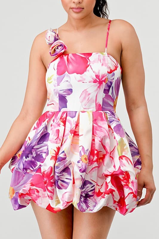 Avah Couture-If you love a sweet, feminine floral dress, this adorable bubble mini is for you. The 3-dimensional rosette on the shoulder strap perfectly complements the beautiful floral print and bubble hem detail. This on-trend mini dress has spaghetti straps and a back zipper and will look great with sandals, pumps, or your new favorite wedges- Pink Purple White 