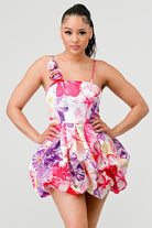 Avah Couture-If you love a sweet, feminine floral dress, this adorable bubble mini is for you. The 3-dimensional rosette on the shoulder strap perfectly complements the beautiful floral print and bubble hem detail. This on-trend mini dress has spaghetti straps and a back zipper and will look great with sandals, pumps, or your new favorite wedges- Pink Purple White 