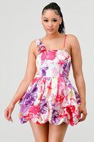 Avah Couture-If you love a sweet, feminine floral dress, this adorable bubble mini is for you. The 3-dimensional rosette on the shoulder strap perfectly complements the beautiful floral print and bubble hem detail. This on-trend mini dress has spaghetti straps and a back zipper and will look great with sandals, pumps, or your new favorite wedges- Pink Purple White 