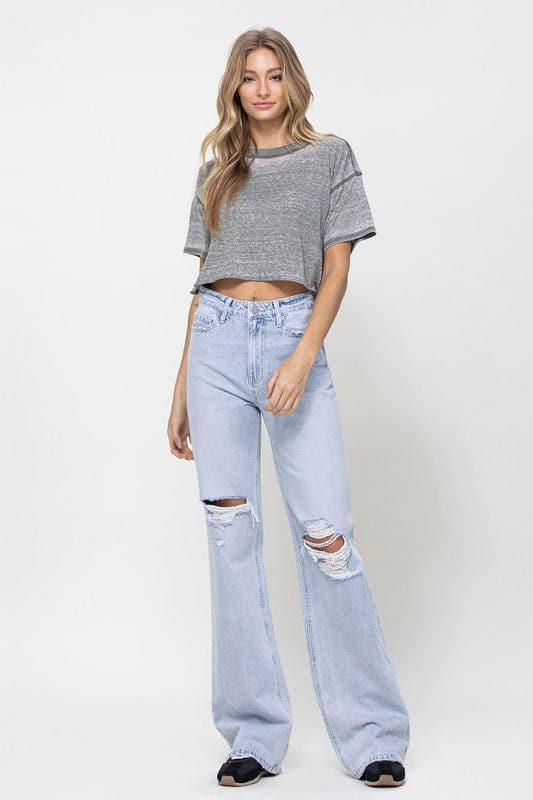 Get all the 90s vibes with these flare jeans. They are a super high-waisted, distressed and relaxed fit jean with a rigid denim texture for that authentic vintage look. Wear them with a chunky knit and platforms or cute crop top and sandals. However you style them, they will soon become your favorite pair of jeans! - Avah Couture