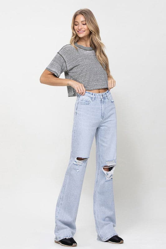 Get all the 90s vibes with these flare jeans. They are a super high-waisted, distressed and relaxed fit jean with a rigid denim texture for that authentic vintage look. Wear them with a chunky knit and platforms or cute crop top and sandals. However you style them, they will soon become your favorite pair of jeans! - Avah Couture