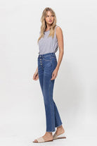 A classic button up jean with a comfortable stretch denim fabric. This mid rise straight leg jean features a versatile cut and elongated hem to create a sleek silhouette with plenty of coverage. A flattering wash that makes it great for pairing with heels or sneakers, this is a must have piece for your wardrobe. Avah Couture