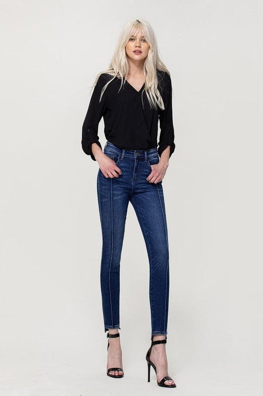 These jeans are cut from comfy stretch denim to sit on your hips and have a high rise that creates a smooth, sculpted shape. We love the ankle skinny fit and uneven hem, perfect to show off your favorite pair of shoes! Avah Couture