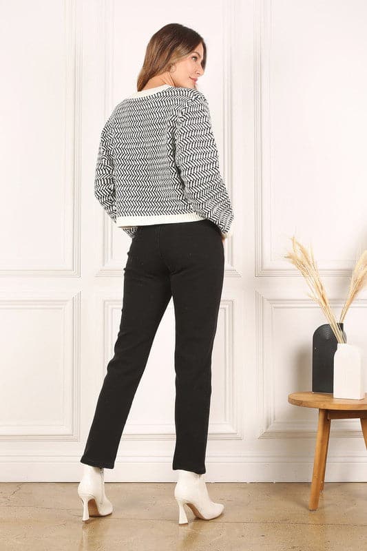 This timeless crew neck sweater with long sleeves will be your go to for years to come in its classic design and comfy fit. The herringbone pattern makes it an excellent piece for dressing up, or down. Avah Couture