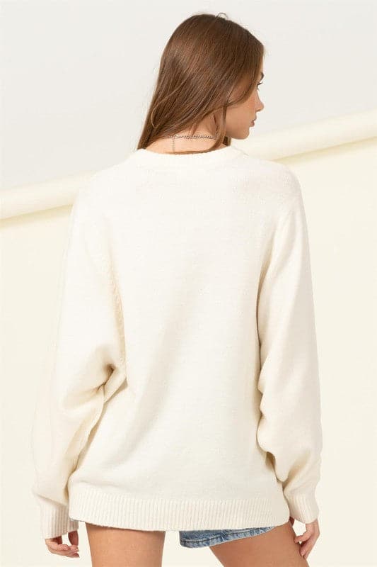 Keep warm and let loose in this must have sweater! The relaxed long sleeves, round neckline and oversized bodice are perfect for pairing with your favorite jeans. The ribbed knit at the cuffs and hem add a stylish touch to this comfy seasonal favorite. Avah Couture