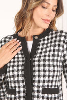 A classic piece that has timeless style, the Black And White Check Jacket is a must have this season. The heavy weight knit fabric features a black and white check pattern that gives it its name. A perfect balance of comfort and style, this jacket features 4 front snap buttons and 2 functional pockets. Wear it with your favorite outfit to work or play a classic piece to get you through any occasion! Avah Couture