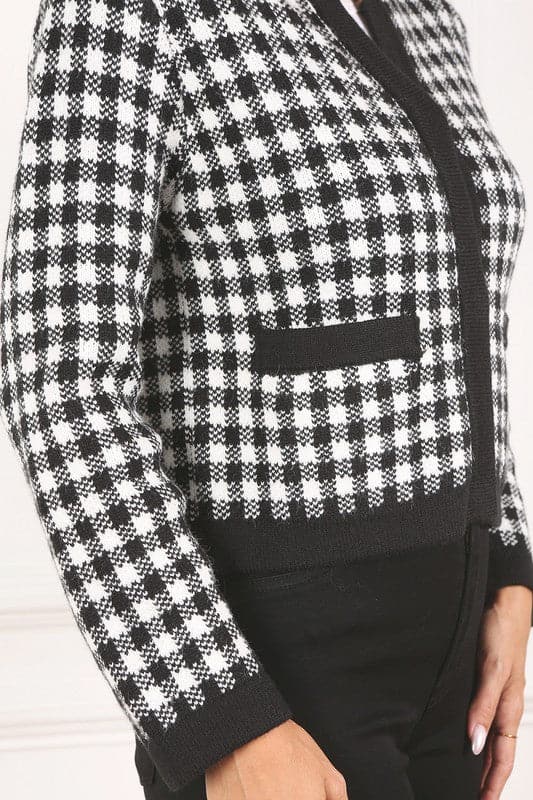 A classic piece that has timeless style, the Black And White Check Jacket is a must have this season. The heavy weight knit fabric features a black and white check pattern that gives it its name. A perfect balance of comfort and style, this jacket features 4 front snap buttons and 2 functional pockets. Wear it with your favorite outfit to work or play a classic piece to get you through any occasion! Avah Couture