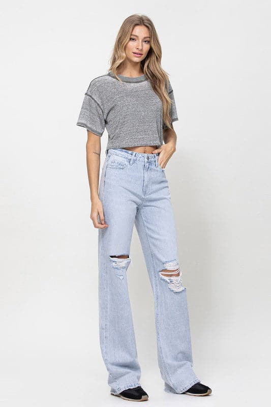 Get all the 90s vibes with these flare jeans. They are a super high-waisted, distressed and relaxed fit jean with a rigid denim texture for that authentic vintage look. Wear them with a chunky knit and platforms or cute crop top and sandals. However you style them, they will soon become your favorite pair of jeans! - Avah Couture