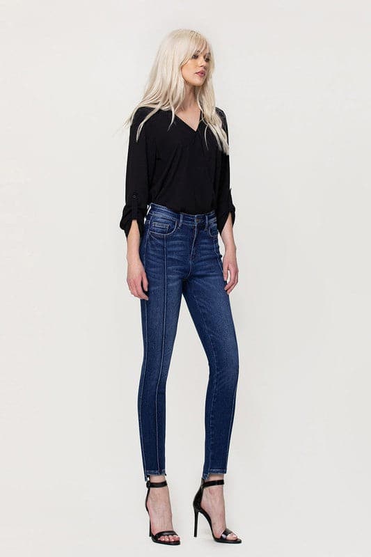 These jeans are cut from comfy stretch denim to sit on your hips and have a high rise that creates a smooth, sculpted shape. We love the ankle skinny fit and uneven hem, perfect to show off your favorite pair of shoes! Avah Couture