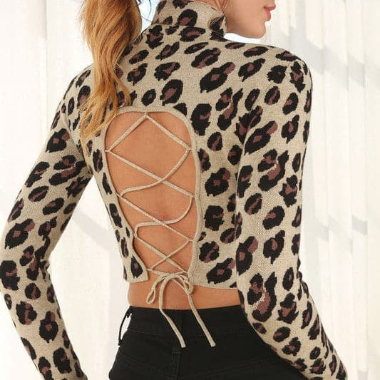 A must have in your wardrobe, this crop top features a mock neck and open back with string closure. The leopard print adds a sexy twist to any outfit. Wear it with your favorite jeans and heels for an after work parry or dress it up with a skirt for a night on the town! Leopard print. Avah Couture