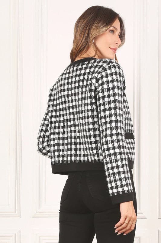 A classic piece that has timeless style, the Black And White Check Jacket is a must have this season. The heavy weight knit fabric features a black and white check pattern that gives it its name. A perfect balance of comfort and style, this jacket features 4 front snap buttons and 2 functional pockets. Wear it with your favorite outfit to work or play a classic piece to get you through any occasion! Avah Couture