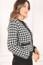 A classic piece that has timeless style, the Black And White Check Jacket is a must have this season. The heavy weight knit fabric features a black and white check pattern that gives it its name. A perfect balance of comfort and style, this jacket features 4 front snap buttons and 2 functional pockets. Wear it with your favorite outfit to work or play a classic piece to get you through any occasion! Avah Couture