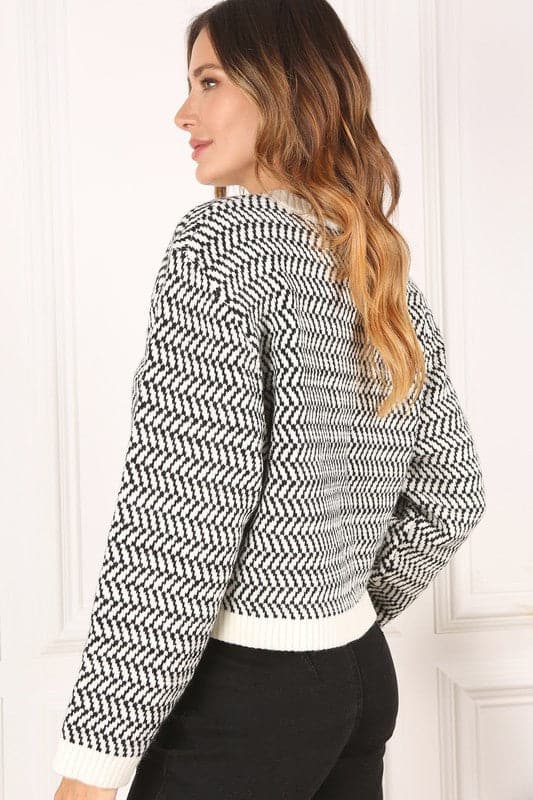 This timeless crew neck sweater with long sleeves will be your go to for years to come in its classic design and comfy fit. The herringbone pattern makes it an excellent piece for dressing up, or down. Avah Couture