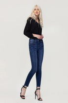 These jeans are cut from comfy stretch denim to sit on your hips and have a high rise that creates a smooth, sculpted shape. We love the ankle skinny fit and uneven hem, perfect to show off your favorite pair of shoes! Avah Couture