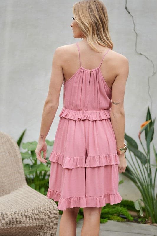 Let the sun shine in with this halter top sundress. Featuring ruffles and tiers, it’s the perfect mix of comfortable and cute. With pockets to keep you organized, this is the best mini dress you need to add to your closet. Avah Couture