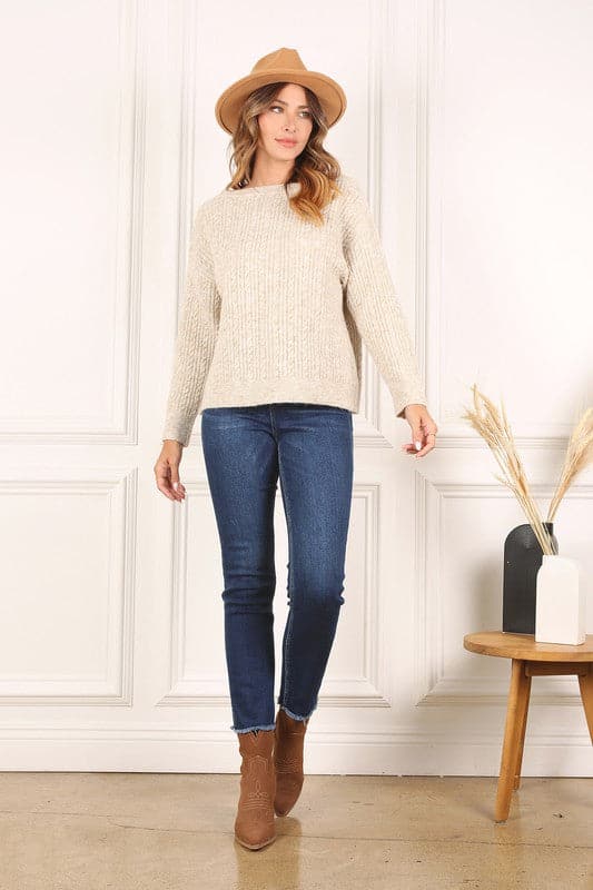 For cozy weekend days and chilly nights, wear this oversized cable sweater. It’s the perfect piece to add to your fall and winter wardrobe. Features a boat neckline, long sleeves and cable pattern in melange. Pair it with jeans for a relaxed look this is still chic.  Avah Couture